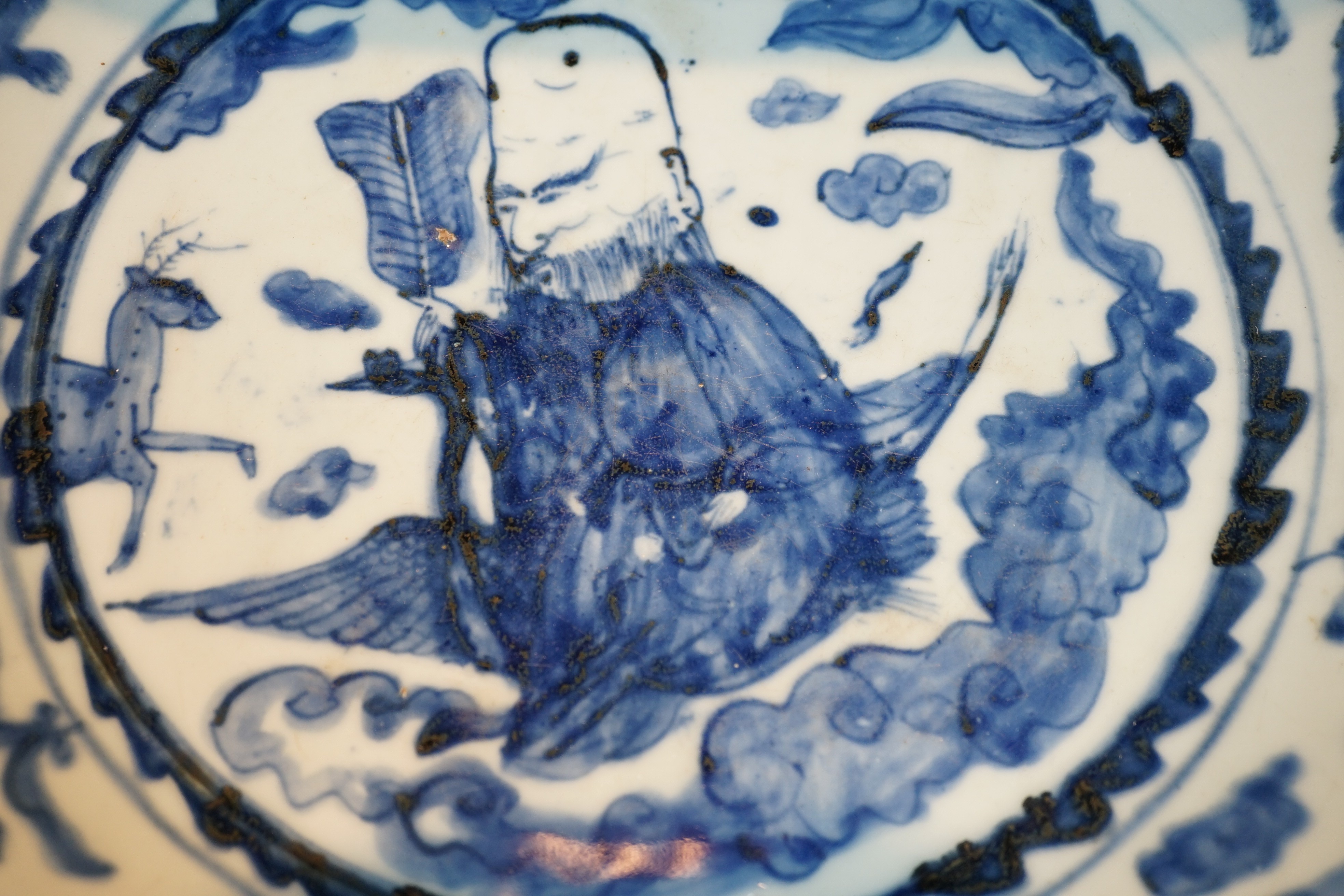 A large Chinese Swatow blue and white ‘Shou Lao’ dish, Zhangzhou kilns, Wanli period, 43.4cm diameter, tiny rim chip